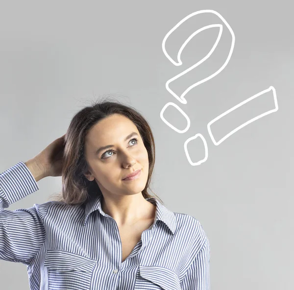 Confused young business woman with question marks above her hea