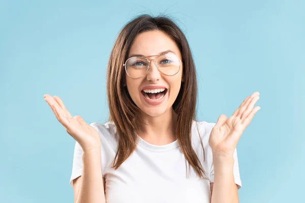 Attractive Cheerful Woman Eyeglasses Showing Wow Gesture Isolated Blue Background — Stok fotoğraf