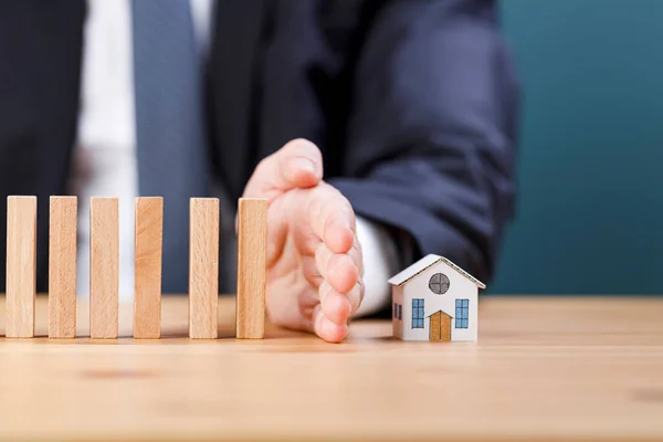 Businessman Hand Stops Wooden Dominoes Falling Model House Possible Risk — Stock Photo, Image