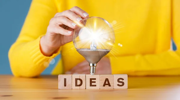 Woman Touching Glowing Light Bulb Ideas Wording Wooden Block Creative — Stock Photo, Image