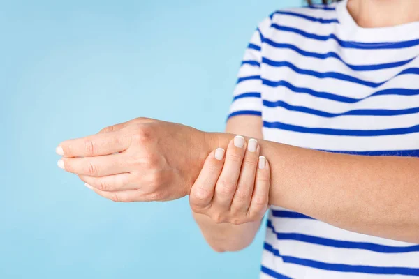 Young Woman Wearing Striped Shirt Touching Her Wrist Pain Front — Stock Photo, Image