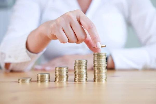 Business woman stacking growth coins. Deposit money saving and business profit growth concept.