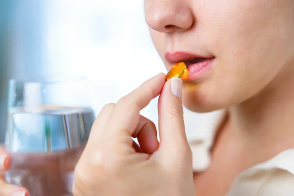Young Woman Taking Omega Capsule — Stock Photo, Image