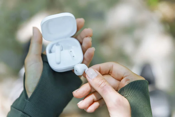 Woman Hand Taking Out White Wireless Earbud Her Charging Box — Stock Photo, Image