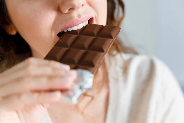 Young Woman Eating Chocolate Home — 图库照片