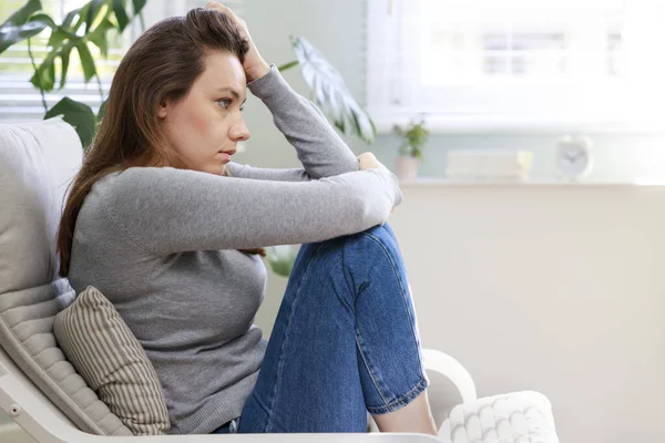 Stressed Young Woman Looking Away Window Sitting Couch Hom — Stock Photo, Image