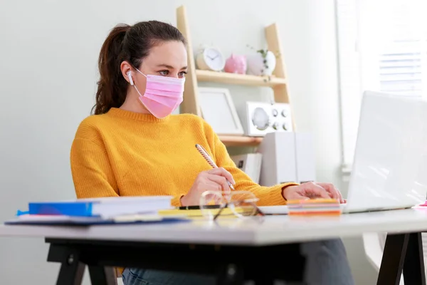 stock image Young woman working from home after coronavirus pandemic