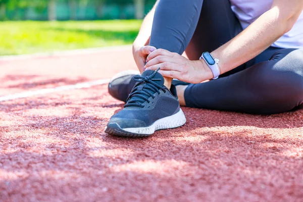 Young Woman Sitting Track Field Suffering Ankle Injury Her Workout — Stock Photo, Image