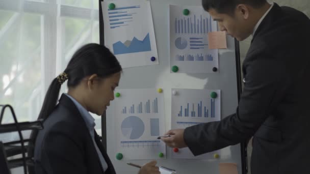 Business Men Women Pens Pointing Financial Graph Hands Business Colleagues — Stock Video