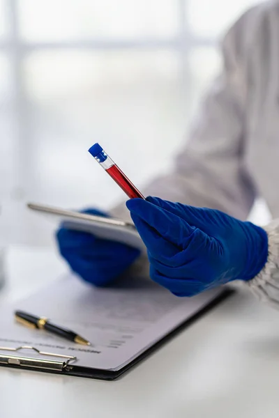 stock image Vascular health doctor in clinical laboratory for medical research and development concepts. and science with a microscope and a test tube placed beside it