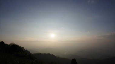 Time-lapse video, evening sunset with clouds flowing time lapse on beautiful nature mountain.