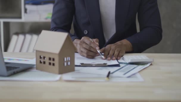 Bank Officer Businessman Working Documents House Model Laptop Table Real — Vídeos de Stock
