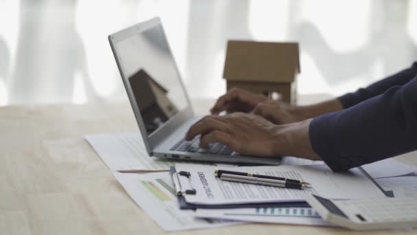 Bank Officer Businessman Working Documents House Model Laptop Table Real — Vídeos de Stock