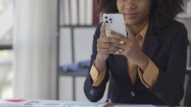 Black and white businesswoman talking on the phone and discussing documents, sales representative talking on the phone, consulting customer closely office work smiling woman