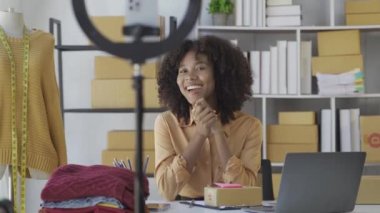 Black Asians sell their products online by live streaming in their channel. Entrepreneurs broadcast online videos to sell dresses and clothes to customers in online platforms or applications.