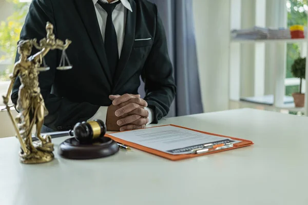 Lawyer working in the office law and justice concept male judge Businessman\'s consultant legal service Advising on various contracts to plan a case in court.