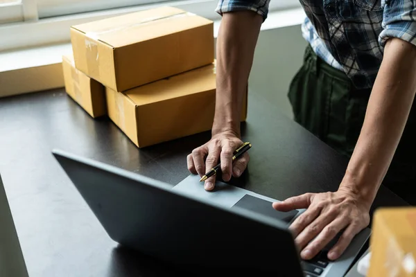 stock image Small business entrepreneurs, take note of shipping addresses from customers, manage orders in online stores, sell online on the internet, SMEs, e-commerce start-ups.