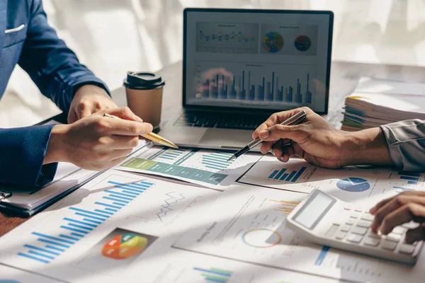 stock image Asian business people meeting, planning and discussing chart data analysis. financial calculations and business efficiency Accounting concept. Marketing. Teamwork with analytical price charts.