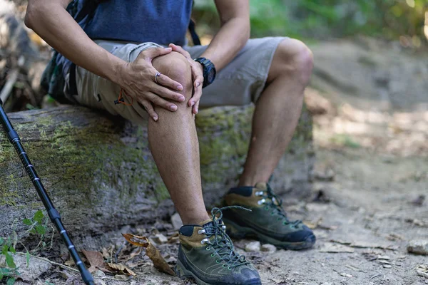 stock image Young man with muscle pain, knee pain from disease or Osteoarthritis and sports injury and medical concept.