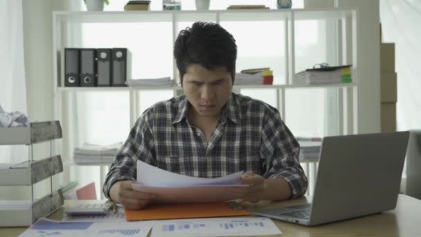 Stressed Young Asian Man Managing Financial Bills Credit Cards Calculing — Vídeo de Stock