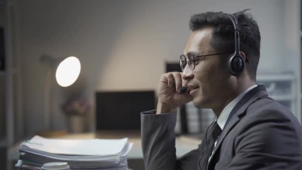 Businessman Wearing Headset Sitting Office Using Desktop Computer Talking Customers — Stock Video