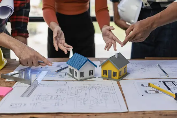 A team of civil engineers plans a building or construction architecture. teamwork leadership Or a designer discussing or discussing floor plan ideas in a meeting, close-up shot.