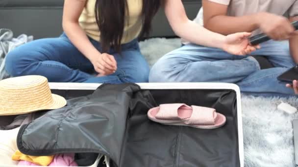Asian Couple Packs Clothes Overseas Trip Stuffing Them Suitcases Living — Stock Video