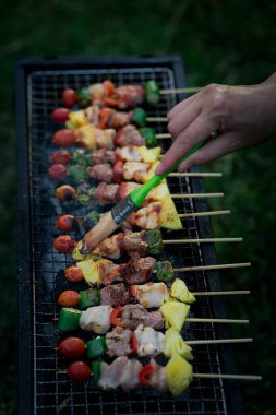 Barbecue Food in nature Cooking on the grill Picnic Holiday in nature Close-up of grilled medium-rare barbecue steak Food concept clipart