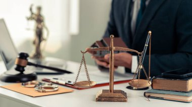 Property Auction and Bidding Miniature Model House with Hammer for Justice on Court Table Real Estate Law Concept