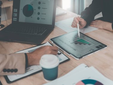 Financial statement analysis team, finance work with smartphones, laptops and tablets with digital marketing media in the form of virtual icons, financial manager meeting.