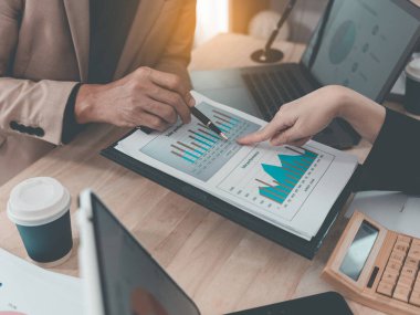 Financial statement analysis team, finance work with smartphones, laptops and tablets with digital marketing media in the form of virtual icons, financial manager meeting.