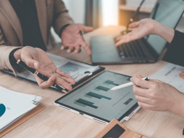 Financial statement analysis team, finance work with smartphones, laptops and tablets with digital marketing media in the form of virtual icons, financial manager meeting.