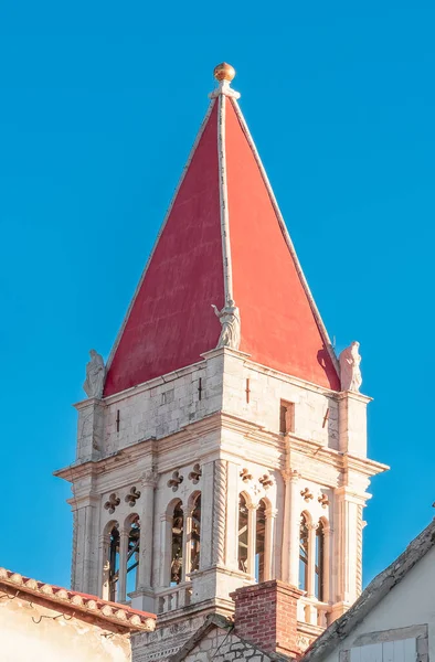 Tower of the Cathedral of Saint Lawrence isolated on blue sky in Trogir, Croatia