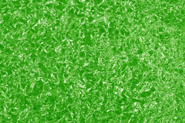 Yeşil kireç folyo parlak doku, arkaplan ve tasarım çalışmaları için soyut ambalaj kağıdı.