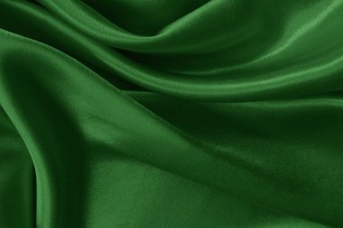 Arkaplan ve tasarım için koyu yeşil kumaş dokusu, güzel buruşmuş ipek ya da keten deseni..
