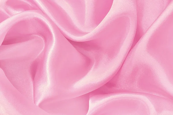 Pink fabric cloth texture for background and design art work, beautiful crumpled pattern of silk or linen.