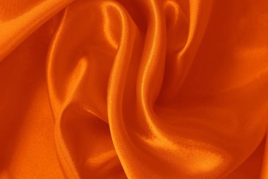 Arkaplan ve tasarım için turuncu kumaş dokusu, güzel buruşmuş ipek ya da keten deseni.