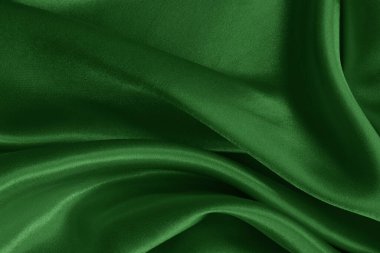 Arkaplan ve tasarım için koyu yeşil kumaş dokusu, güzel buruşmuş ipek ya da keten deseni..