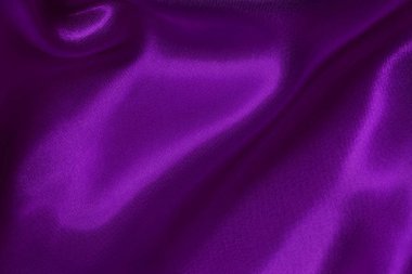 Arka plan ve tasarım için mor kumaş dokusu, güzel buruşmuş ipek ya da keten deseni..