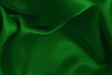 Arkaplan ve tasarım için koyu yeşil kumaş dokusu, güzel buruşmuş ipek ya da keten deseni..