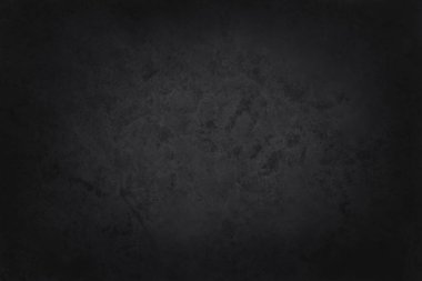Arka plan ve tasarım çalışmaları için yüksek çözünürlüklü doğal desenli koyu gri kayrak dokusu. Siyah taş duvar.