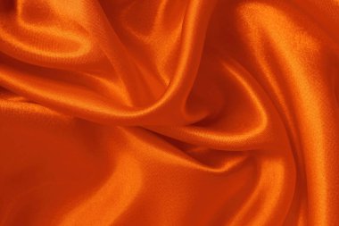 Arkaplan ve tasarım için turuncu kumaş dokusu, güzel buruşmuş ipek ya da keten deseni.