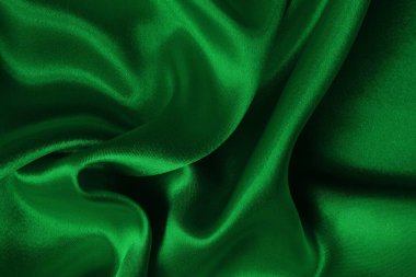 Arkaplan ve tasarım için koyu yeşil kumaş dokusu, güzel buruşmuş ipek ya da keten deseni..