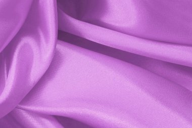 Arka plan ve tasarım için mor kumaş dokusu, güzel buruşmuş ipek ya da keten deseni..