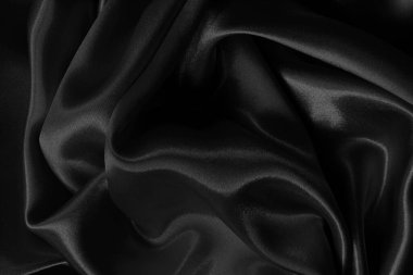 Arkaplan ve tasarım için siyah kumaş dokusu, güzel buruşmuş ipek ya da keten deseni..