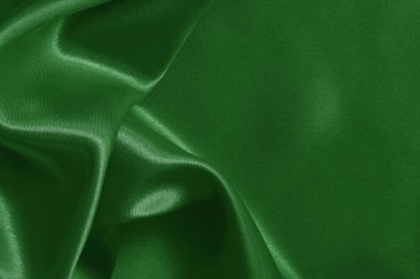 Arkaplan ve tasarım için koyu yeşil kumaş dokusu, güzel buruşmuş ipek ya da keten deseni..