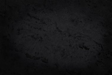 Arka plan ve tasarım çalışmaları için yüksek çözünürlüklü doğal desenli koyu gri kayrak dokusu. Siyah taş duvar.