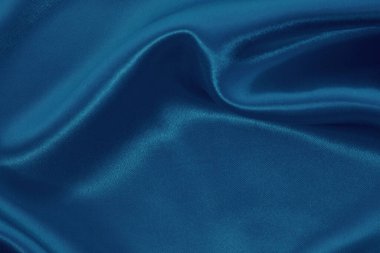 Arkaplan ve tasarım için koyu mavi kumaş dokusu, güzel buruşmuş ipek ya da keten deseni..