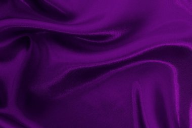 Arka plan ve tasarım için mor kumaş dokusu, güzel buruşmuş ipek ya da keten deseni..