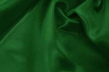 Arkaplan ve tasarım için koyu yeşil kumaş dokusu, güzel buruşmuş ipek ya da keten deseni..
